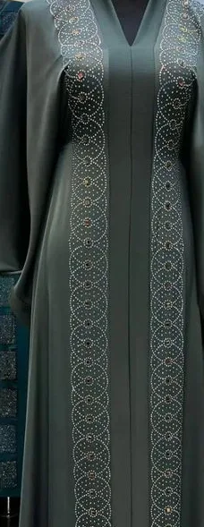 A deep-green abaya with crystal embellishment, detail of the centre panel